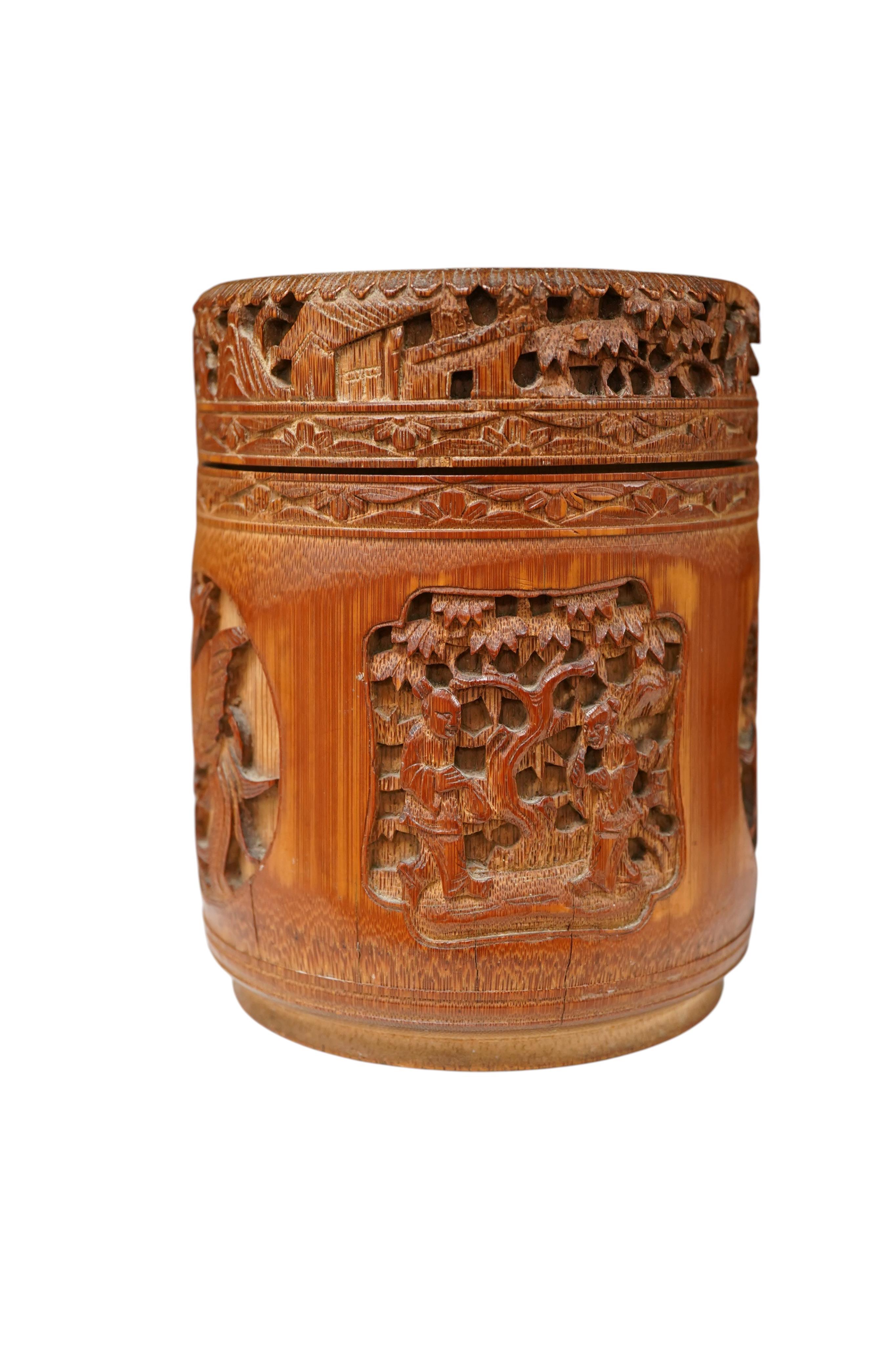 A Chinese carved bamboo tobacco jar and cover, 15cm high